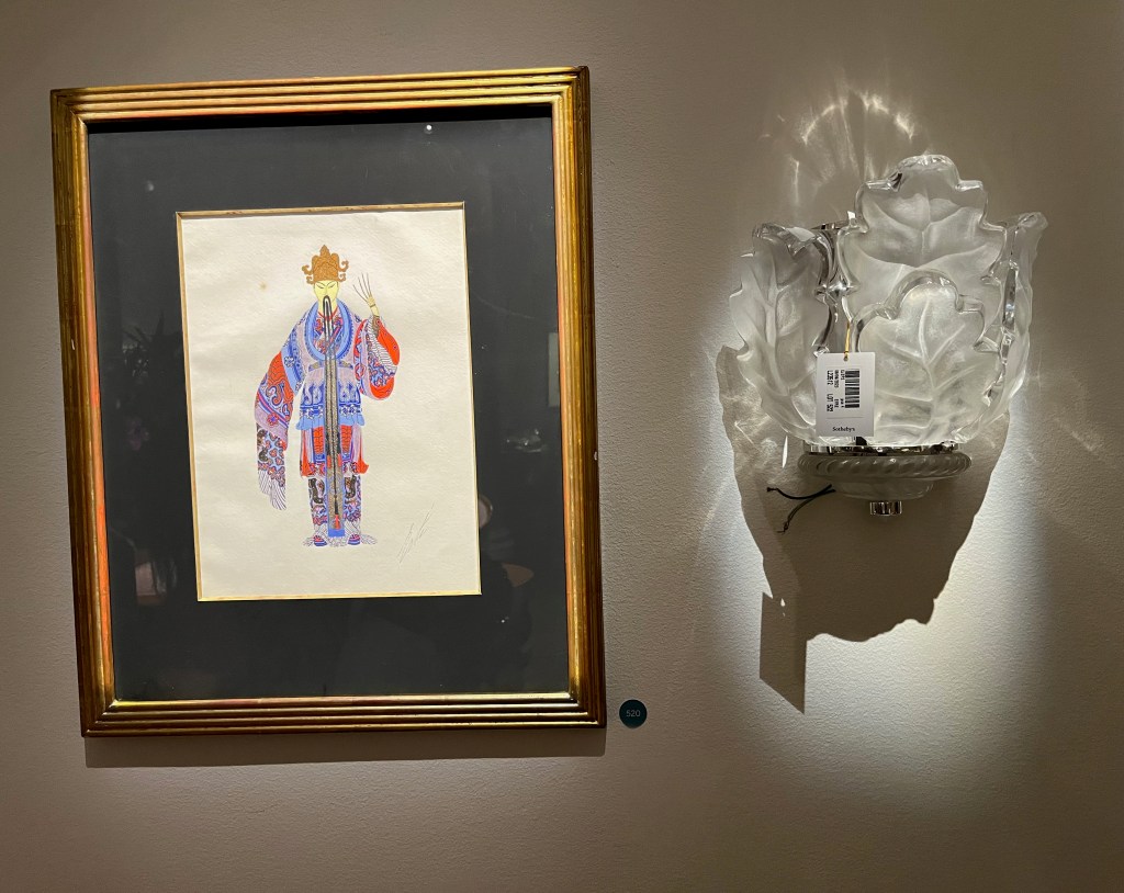 Paintings by French artist Erté called Chang-Ti, s showing a figure dressed in a very colourful oversized kimono. They have very long, thin fingernails, while both sides of their thin moustache and their thin beard stretch down so far that they almost touch the floor.