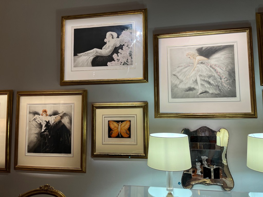 4 artworks by Louis Icart, showing female figures posing in various ways, including one where the woman is the central body of a butterfly, with large wings either side of her.