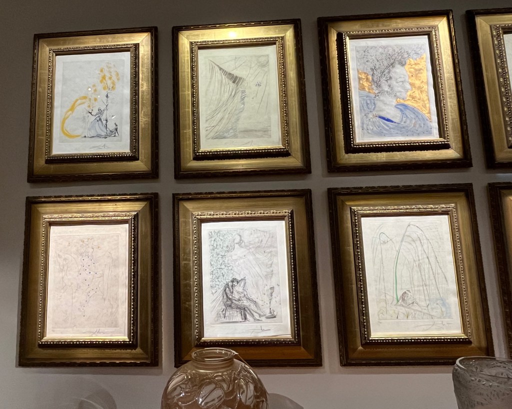 A set of 6 sketches by surrealist Salvador Dali, mainly black and white but with occasional elements of colour. It's hard to determine exactly what they're meant to show, though one appears to show the head of an old lady standing in a pool of water.