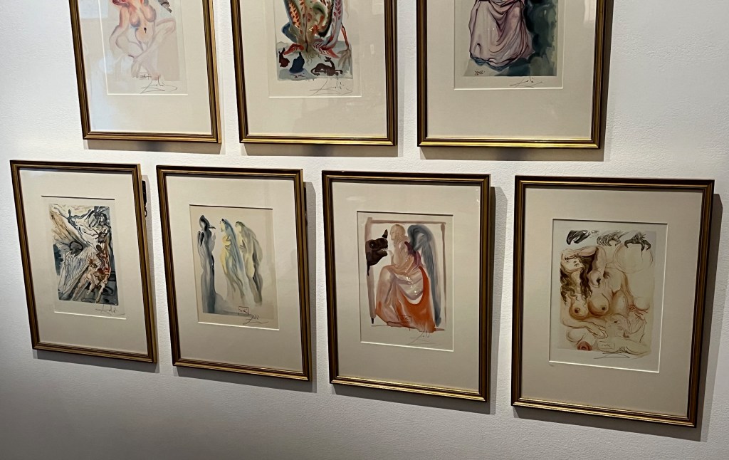 4 paintings by Salvador Dali, showing very surreal imagery, including a woman in a long dress that appears to be putting her hand into the mouth of a silhouette of a rhino.