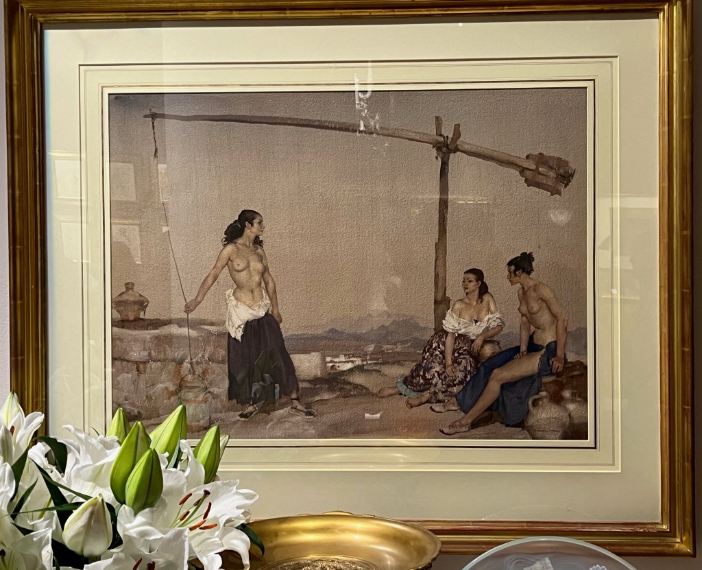 A watercolour painting by Sir William Russell Flint called Disputation at the Well. It shows. It shows a topless lady standing by a well, facing two ladies who are sitting down, one of whom is also topless, and other's dress is very low cut.