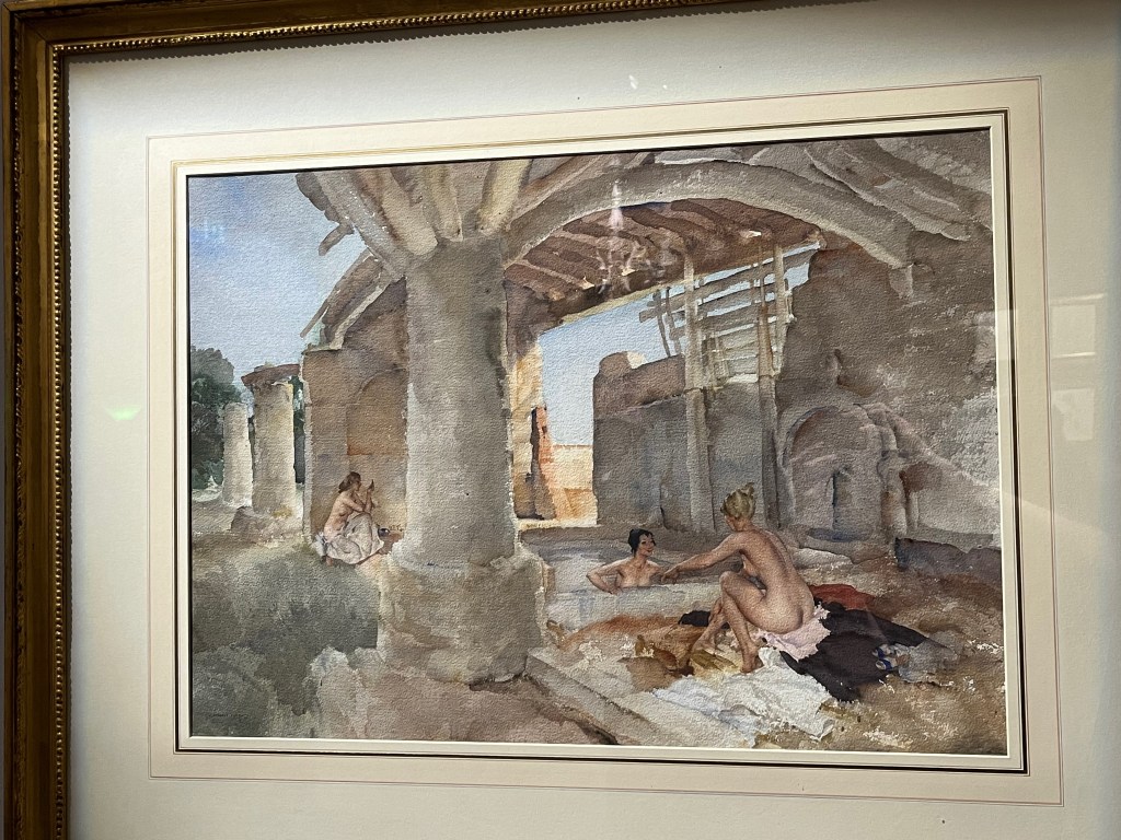 Watercolour painting by Sir William Russell Flint called Silver Shade, Languedoc. It shows two naked women dipping in a pool in the shade beneath a large stone archway held up by thick pillars.