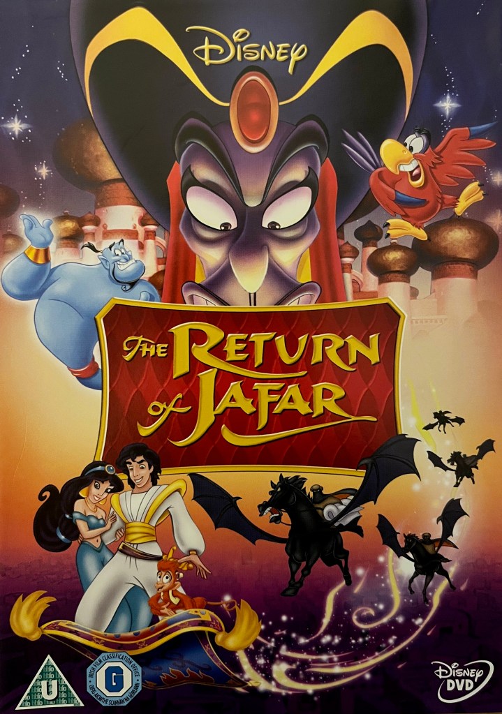 Front cover for the DVD of Aladdin, The Return Of Jafar. It shows the evil face of Jafar looming large over the top of the movie's title, with the palace in the background. His red parrot assistant Iago is flying next to him on the right, while the blue genie is floating on the left. At the bottom, Aladdin, Jasmine and monkey Abu fly on the magic carpet, smiling together as if unaware of the 4 angry-looking black horses with large wings flying towards them.