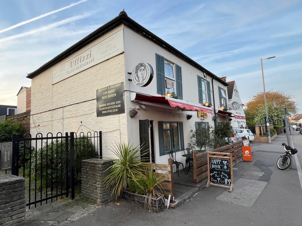 The Uffizzi restaurant, a white, flat-roofed two-storey building.