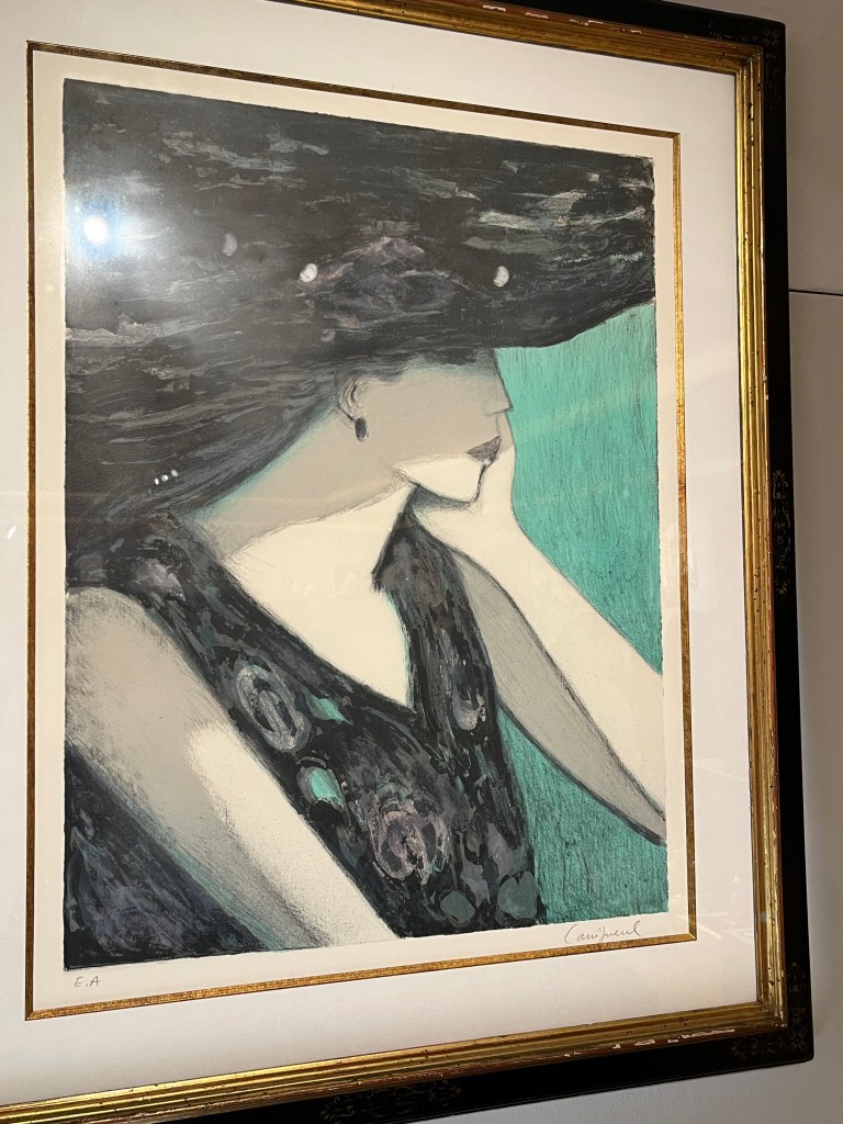 A black and white painting of a woman in a sleeveless v-neck top looking thoughtful as she rests her chin on her hand.