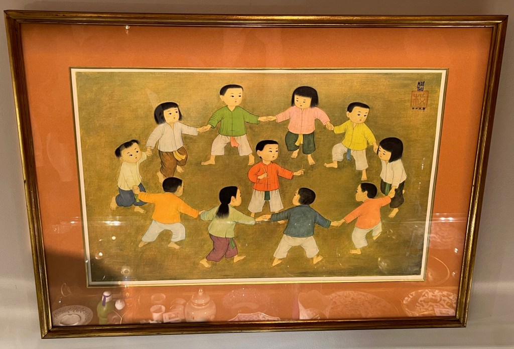 A painting of a group of ten children holding hands in a circle, with another child standing in the middle.