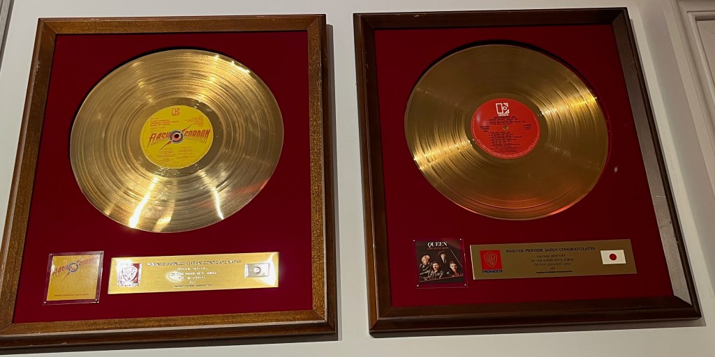 Japanese gold disc awards for Flash Gordon and Greatest Hits.