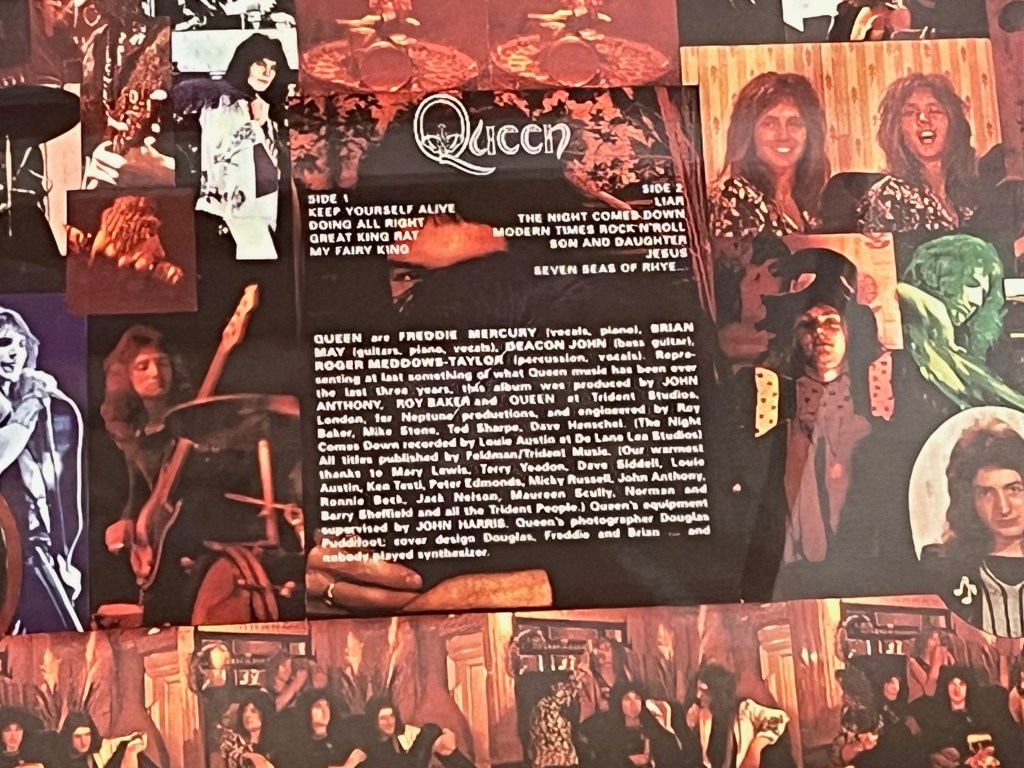 Close-up of the track listing and credits on the back of Queen's debut album, surrounded by a collage of photos of the band members.