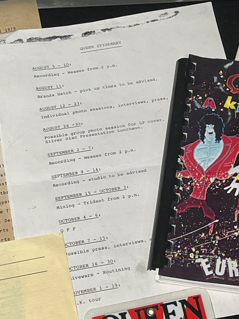 An itinerary for Queen starting in August 1974, including recording sessions in Wessex Studios, photo sessions, a visit to Brands Hatch, press interviews, and a UK tour in November.