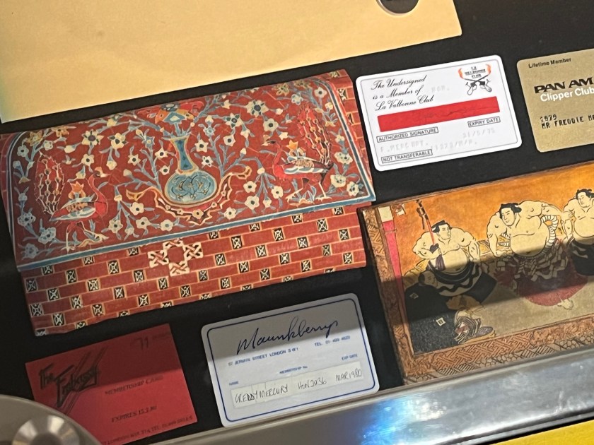 Two wallets with colourful Japanese designs, and membership cards for La Valbonne Club, Pan Am Clipper Club, The Embassy Club and Maunkberry's.