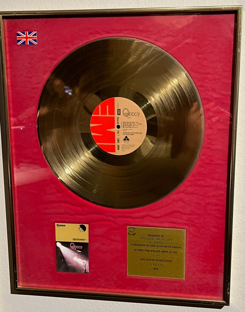 A gold disc sales award for Queen's self-titled debut album.