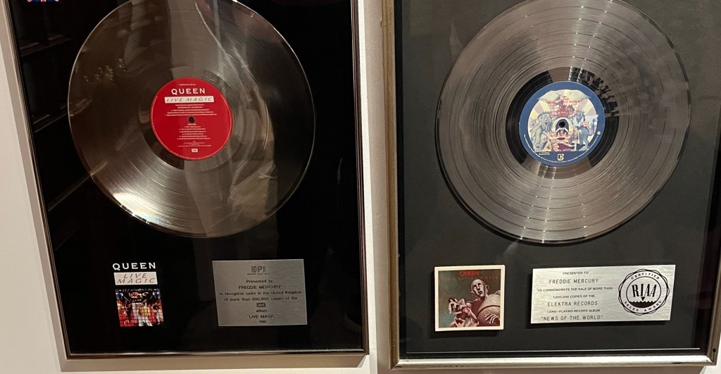 Disc sales awards for Live Magic and News Of The World.