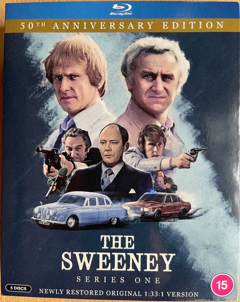 Front cover for The Sweeney Series 1 on Blu-ray, showing a large colour image of Regan and Carter, played by John Thaw and Dennis Waterman. Below them is another image of the two of them, this time pointing guns ahead of them, along with their boss Frank Haskins and a police car chasing another car.