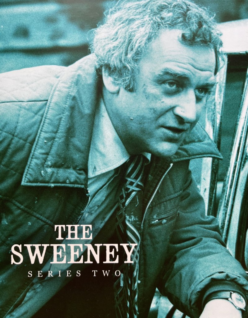 Front cover of the booklet included in the Blu-ray boxset for The Sweeney Series 2. It shows a green-tinted image of Regan wearing a thick coat over his shirt and tie.