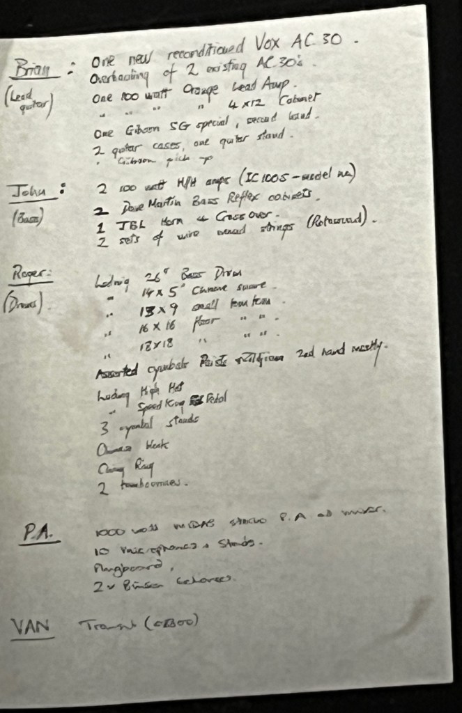 A handwritten list of equipment required by the members of the band Queen, with headings for Brian on Lead Guitar, John on Bass, Roger on Drums, P.A. and Van.