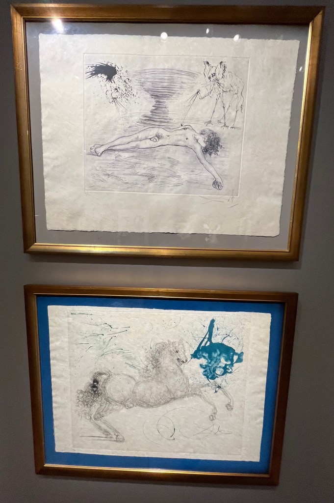 2 prints by Salvador Dali from his Mythology series, one showing a naked body on the ground with a whirlwind behind, while the other includes a galloping horse.