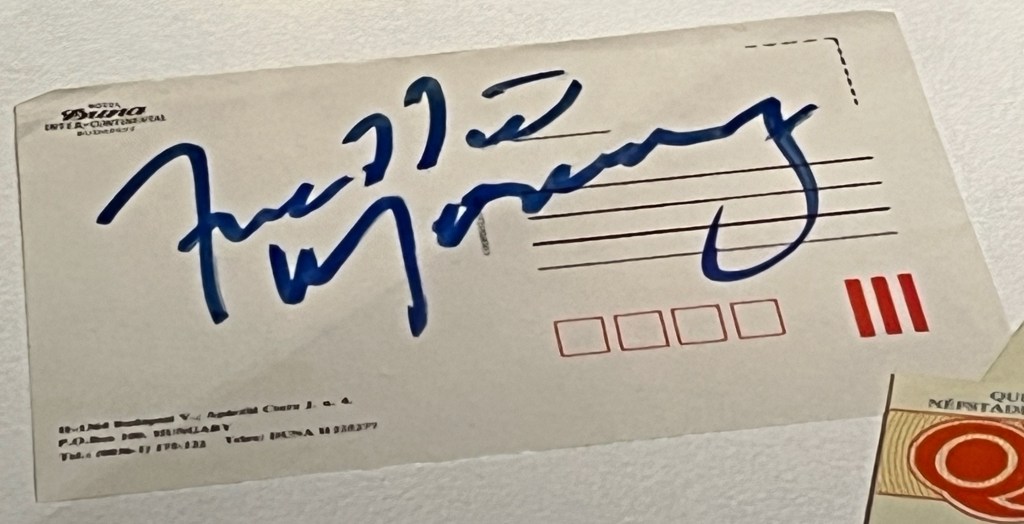 Freddie Mercury's signature on the back of postcard.