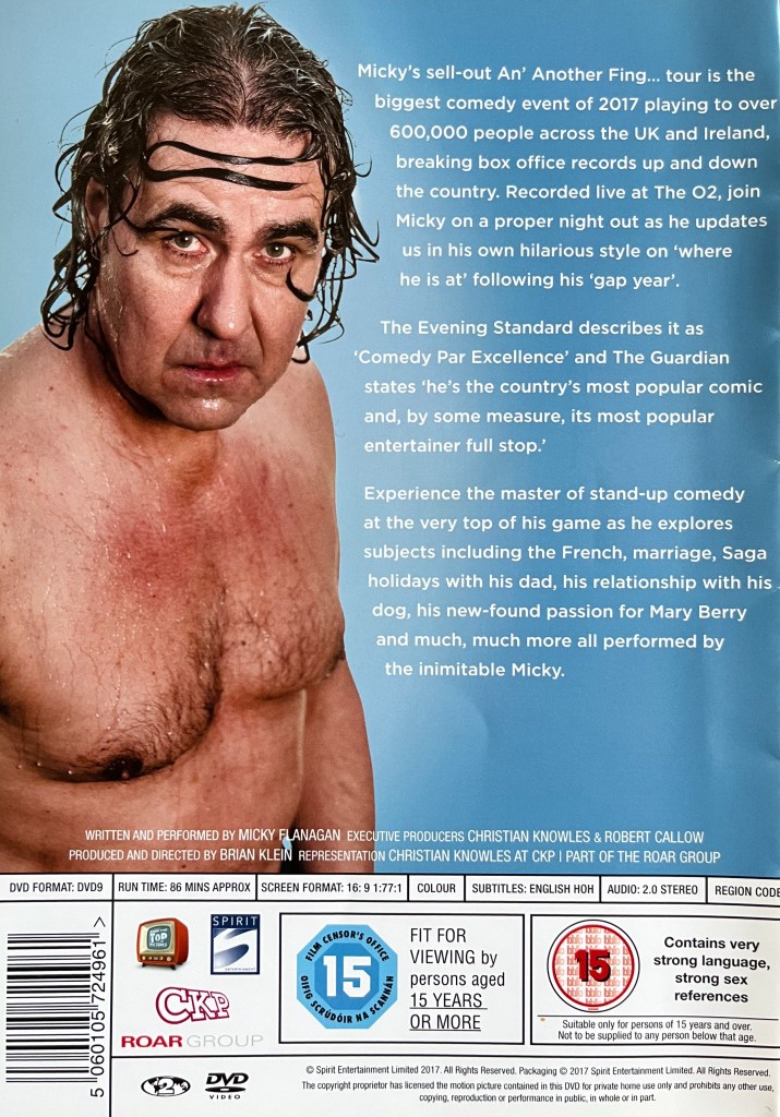Back cover of the DVD for Micky Flanagan, 'An Another Fing Live. Alongside a description of the DVD is a picture of Micky soaking wet, topless and looking fed up, as if he's just come out of a shower.
