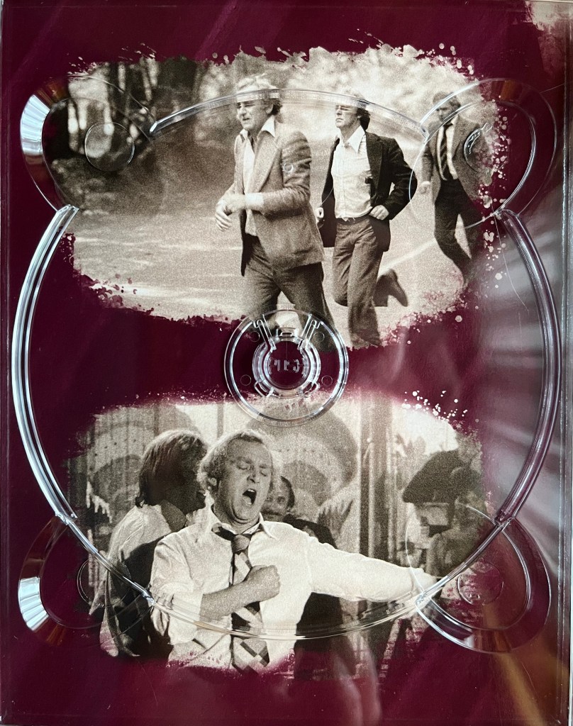 Two black and white photos. The top one shows Regan and Carter running, along with a colleague, while the bottom image shows Regan pumping his right fist to his chest while his left arm is stretched out to the side, his eyes are closed and his mouth is open wide. The images are placed on a red background, and are from one of the panels in the Blu-ray box set for The Sweeney Series 3.