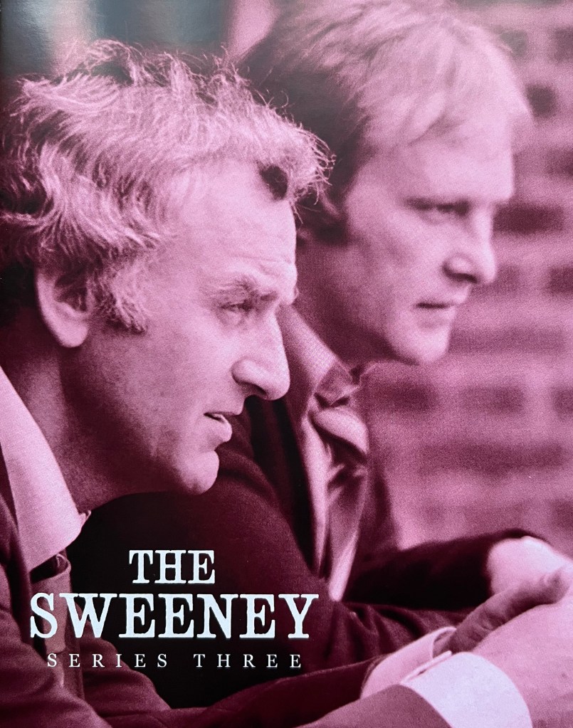 Front cover of the booklet included in the Blu-ray boxset for The Sweeney Series 3. It shows a red-tinted image of Regan and Carter observing something unseen to the right.