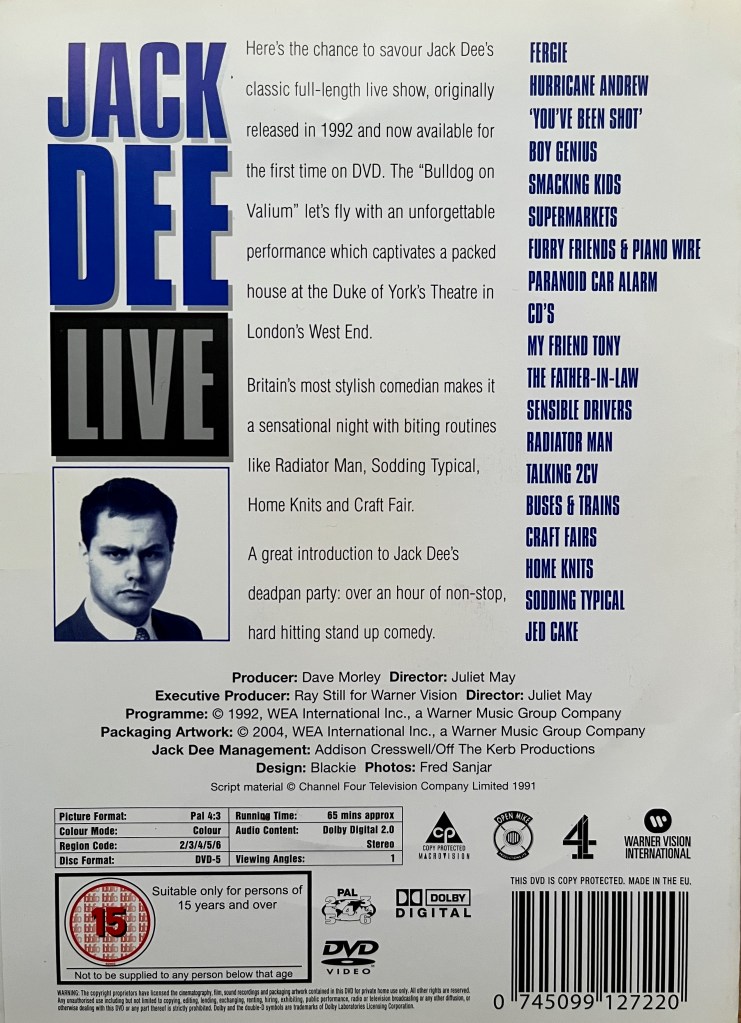 Back cover of the DVD for Jack Dee Live at the Duke of York's Theatre, with a white background. On the left is the title Jack Dee Live above a headshot of Jack, while in the centre is a description of the DVD, and then on the right is a list of the chapter headings. The bottom of the cover then has a full width section with the technical and copyright information.