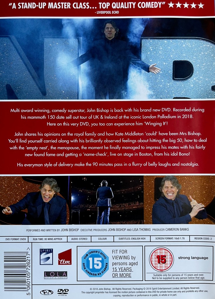 Back cover of John Bishop's DVD called Winging It. It shows 4 images of John performing on stage alongside the description of the show. There are no extra features.