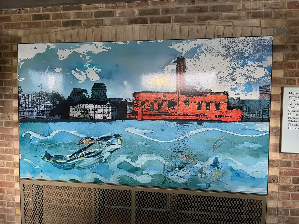 A painting of an animal like a porpoise or a whale swimming along the Thames, passing the Globe Theatre and Tate Modern on the opposite bank.