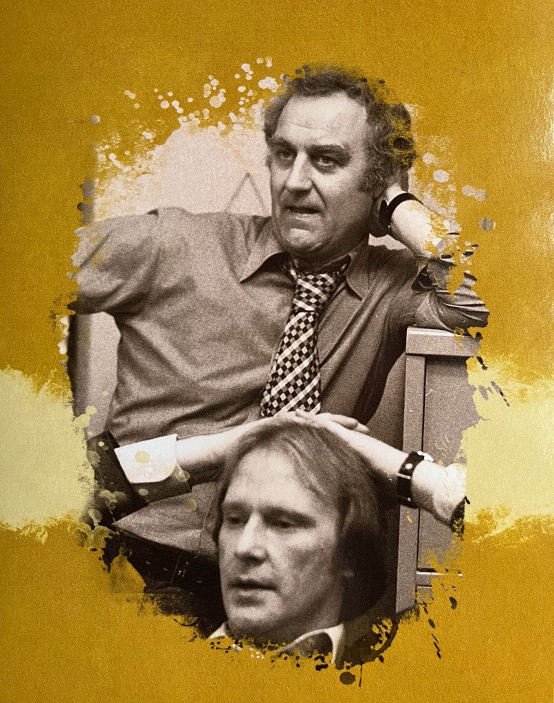 A black and white photo of Regan standing and looking thoughtful as he rests his elbow on a tall piece of furniture next to him. Carter is sat down in front of him, resting his hands on his head with the fingers interlocked. The image is placed on a gold background, and is from one of the panels in the Blu-ray box set for The Sweeney Series 4.