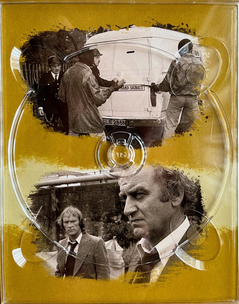 2 black and white photos. The top photo shows a confrontation at the back of a van, with one man pointing a gun at three others men. The bottom photo shows Carter and Regan standing outside with serious expressions on their faces. The images are placed on a gold background, and are from one of the panels in the Blu-ray box set for The Sweeney Series 4.