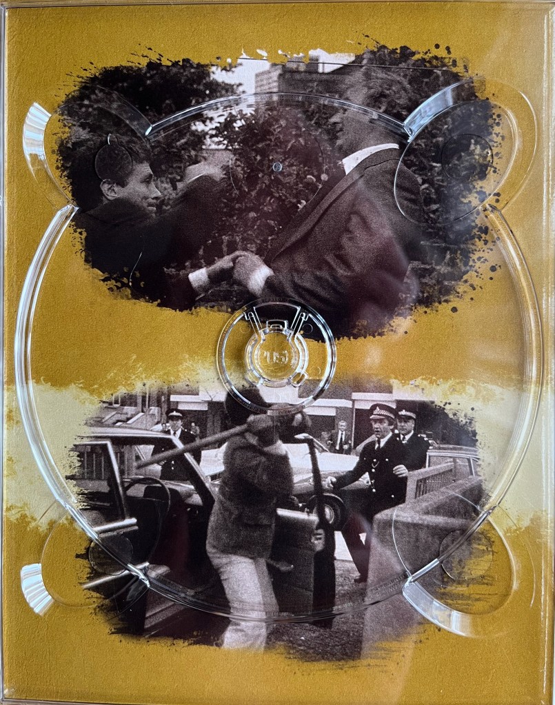 2 black and white photos. The top photo shows two men shaking hands, while the man on the left raises his other arm. The bottom photo shows two policeman running up to a man who is getting out of a car, with Regan catching them up in the background. The images are placed on a gold background, and are from one of the panels in the Blu-ray box set for The Sweeney Series 4.