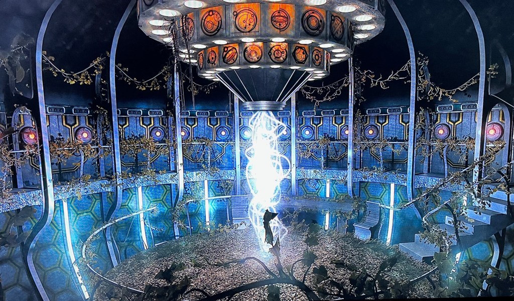 Background for the main menu on the Blu-ray for Doctor Who Series 7. It shows the interior of the Tardis, which has greenery sprouting all over it as if it's been abandoned. And Instead of a console in the centre, it shows a bright vertical tower of swirling light that stretches from the floor to the ceiling.