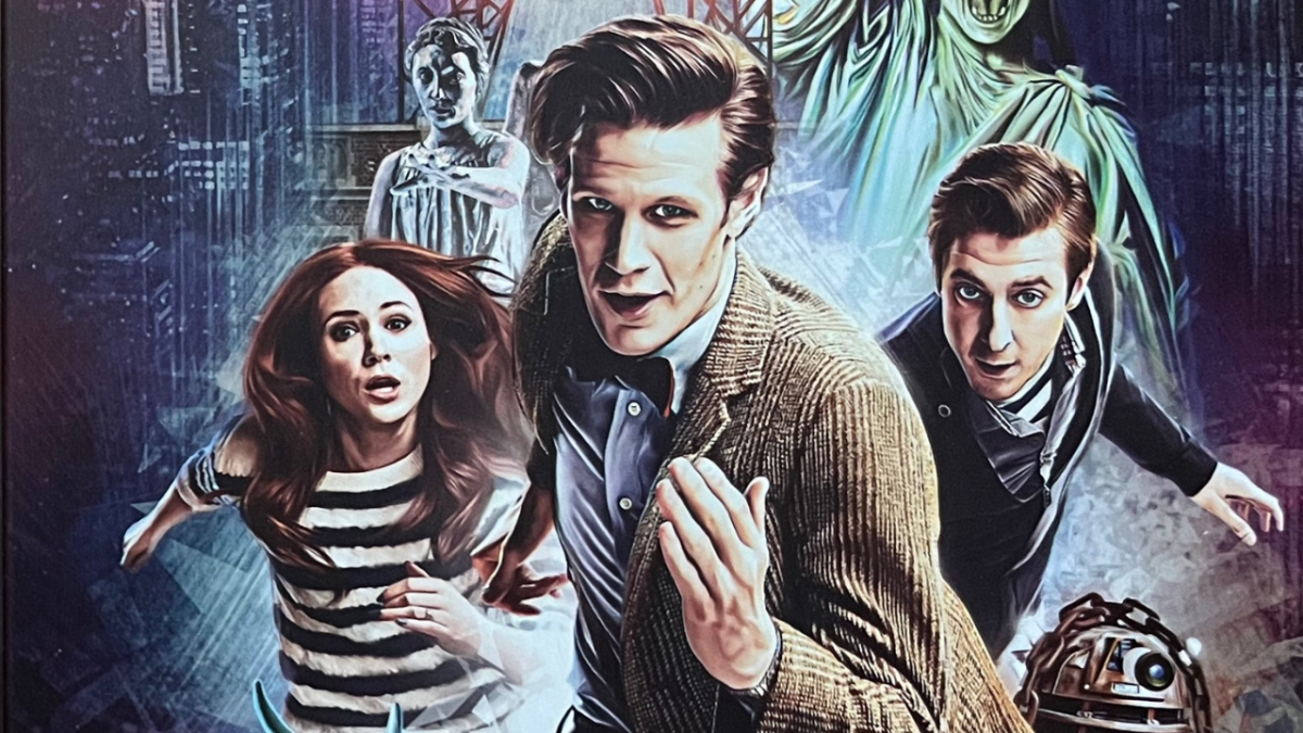 Part of the cover artwork for the Doctor Who Series 7 Blu-ray steelbook, showing Matt Smith's Doctor with Amy and Rory running towards us, with a couple of Weeping Angels behind them, and the head of the Dalek just visible at the bottom.
