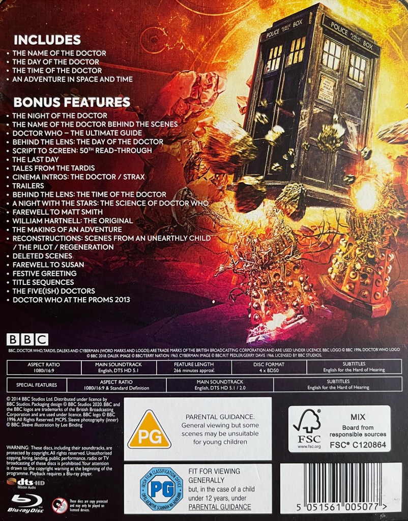 The back of the cardboard slipcase cover for the Doctor Who 50th Anniversary Specials Blu-ray steelbook. To the right of the list of episodes and extra features is an image showing a battered Tardis flying in front of a huge fireball, with Daleks exploding around it.