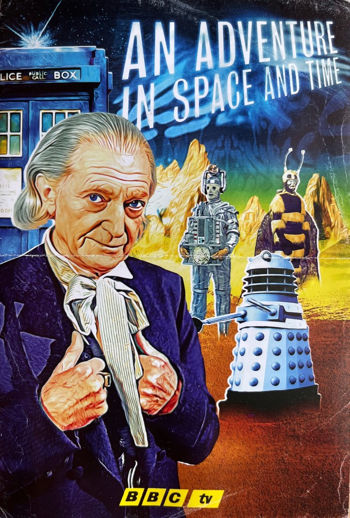 Front of the leaflet from the Blu-ray for the Doctor Who biographical drama An Adventure In Space And Time. It shows an artist's impression of the first Doctor, while behind him is the Tardis, a Cyberman, a Dalek, and an alien that looks like a man in a bee costume.