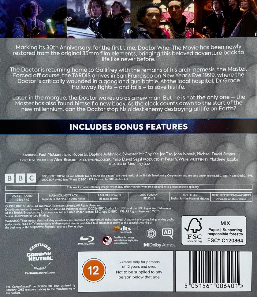 Alternate back cover for the Blu-ray of Doctor Who The Movie, designed to match previous Classic era releases, featuring a grey background with lighter grey circles embedded into it. At the top is a strip of 4 images from the film. The first shows Sylvester McCoy as the 7th Doctor. The second shows Paul McGann as the 8th Doctor with companion Grace. The third shows The Master with companion Chang Lee. And the fourth shows the 8th Doctor with Grace and Chang Lee. Below that is a description of the Blu-ray followed by technical and copyright information.