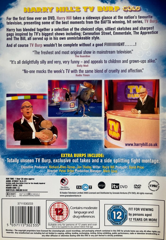 Back cover of the DVD for Harry Hill's TV Burp Gold, containing a few images from the show below the description of the DVD, including Harry playing a pair of bongos and a person dressed as a toaster fighting someone dressed as a shark. The third image simply shows Harry sitting at his desk in the studio.
