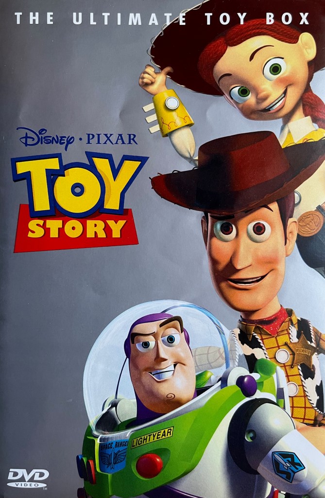 DVD cover for Toy Story - The Ultimate Toy Box, which has a grey background. On the left side is the logo from the film, while on the right side, from top to bottom, are cowgirl Jessie, cowboy Woody and Space Ranger Buzz.